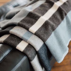 Soft, striped blanket casually draped over furniture.