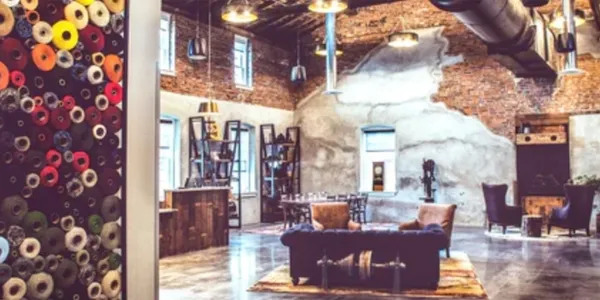 Cozy living room with modern rustic decor and exposed brick walls.