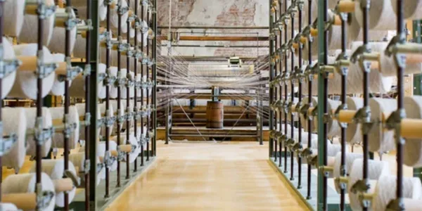 Long aisle in a building with bookshelves on both sides.